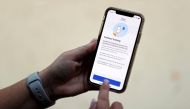 The coronavirus disease (COVID-19) contact tracing smartphone app of Britain's National Health Service (NHS) is displayed on an iPhone in this illustration photograph taken in Keele, Britain, September 24, 2020. REUTERS/Carl Recine/Illustration/File Photo