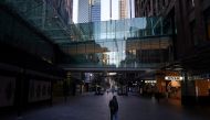 A man wears a protective face mask at the unusually quiet Pitt Street Mall in the City Centre during a lockdown to curb the spread of the coronavirus disease (COVID-19) outbreak in Sydney, Australia, July 21, 2021. REUTERS/Loren Elliott