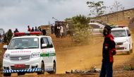 Ambulances are seen at a burial area provided by the government for coronavirus disease (COVID-19) victims, as cases surge in Jayapura, Papua, Indonesia July 20, 2021, in this photo taken by Antara Foto/Indrayadi TH/via REUTERS