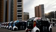 Electric vehicles are pictured at an internal shuttle bus station of the Tokyo 2020 Olympic and Paralympic Village in Tokyo, Japan, June 20, 2021. REUTERS/Kim Kyung-Hoon/File Photo