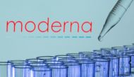 Test tubes are seen in front of a displayed Moderna logo in this illustration taken, May 21, 2021. REUTERS/Dado Ruvic/Illustration/File Photo