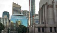 A lone woman walks past the Anzac Memorial as Hyde Park is mostly devoid of people during a lockdown to curb the spread of a coronavirus disease (COVID-19) outbreak in Sydney, Australia, July 22, 2021. REUTERS/Loren Elliott