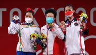 Gold medalist Hou Zhihui of China, Silver medalist Mirabai Chanu Saikhom of India and Bronze medalist Windy Cantika Aisah of Indonesia pose. (REUTERS/Edgard Garrido)