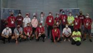 President of Qatar Olympic Committee (QOC), H E Sheikh Joaan bin Hamad Al Thani, posing for a photograph with Team Qatar athletes and officials during a visit to the Athletes Village of the Tokyo 2020 Olympics, yesterday. QOC Secretary-General Jassim bin 