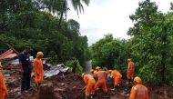 Members of National Disaster Response Force (NDRF) conduct a search and rescue operation after a landslide following heavy rains in Ratnagiri district, Maharashtra state, India, July 25, 2021. National Disaster Response Force/Handout via REUTERS