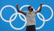 Gold medalist Ahmed Hafnaoui of Tunisia celebrates REUTERS/Kai Pfaffenbach