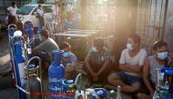 Locals line up with their tanks to refill oxygen during the coronavirus disease (COVID-19) outbreak in Yangon, Myanmar, July 14, 2021. Reuters/Stringer/File Photo