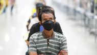 People queue at the Central Vaccination Center as Thailand opens walk-in for first dose of the AstraZeneca vaccination scheme for elders, people with a minimum weight of 100 kilograms and pregnant women amid the coronavirus (COVID-19) outbreak in Bangkok,