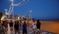 Tourists enjoy Benidorm's Levante beach at night, Spain, July 22, 2021. REUTERS/Eva Manez NO RESALES. NO ARCHIVES.
