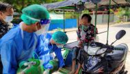 FILE PHOTO: Volunteers help provide a coronavirus (COVID-19) patient with extra oxygen in the town of Kale, Sagaing Region, Myanmar, July 5, 2021. Picture taken July 5, 2021. REUTERS/Stringer/File Photo