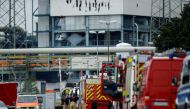 Firefighters stand outside Chempark following an explosion in Leverkusen, Germany, July 27, 2021. REUTERS/Leon Kuegeler