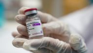 A health worker shows a vial of the AstraZeneca Covid-19 vaccine. Reuters/Athit Perawongmetha/File Photo
