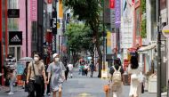 People wearing masks walk in a shopping district amid the coronavirus disease (COVID-19) pandemic in Seoul, South Korea, July 9, 2021. REUTERS/ Heo Ran