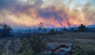 Plumes of black smoke rise from the forest around Manavgat, 75 km (45 miles) east of the resort city of Antalya, Turkey, July 28, 2021. REUTERS/Kaan Soyturk TPX IMAGES OF THE DAY
