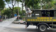 Military personnel spray disinfectant on the streets during a lockdown designed to curb the spread of COVID-19 in Hanoi, Vietnam, on July 26, 2021. REUTERS/Stringer/File Photo