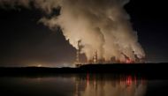 Smoke and steam billows from Belchatow Power Station, Europe's largest coal-fired power plant operated by PGE Group, at night near Belchatow, Poland December 5, 2018. REUTERS/Kacper Pempel/File Photo