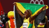 Elaine Thompson-Herah of Jamaica celebrates winning the gold medal. (Reuters/Kai Pfaffenbach)