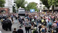 Demonstrators attend a protest against government measures to curb the spread of coronavirus disease (COVID-19) in Berlin, Germany August 1, 2021. REUTERS/Christian Mang
