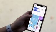 The coronavirus disease (COVID-19) contact tracing smartphone app of Britain's National Health Service (NHS) is displayed on an iPhone in this illustration photograph taken in Keele, Britain, September 24, 2020. REUTERS/Carl Recine/Illustration/File Photo