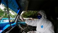 File Photo: Sunaryo drives an ambulance as he delivers a patient suffering from coronavirus disease (COVID-19), as cases surge in Depok, on the outskirts of Jakarta, Indonesia, July 13, 2021. REUTERS/Ajeng Dinar Ulfiana
