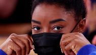Simone Biles of the United States wearing a protective face mask looks on REUTERS/Mike Blake