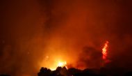 Night sky turns orange as Turkey's wildfires rage on at the shores of Cokertme village near Bodrum, Turkey, August 2, 2021. REUTERS/Umit Bektas
