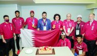 Qatar Olympic Committee President Sheikh Joaan bin Hamad Al Thani, Qatar Athletics Federation President Dr Thani bin Abdulrahman Al Kuwari, officials and Team Qatar athletes pose for a photograph as they celebrate the gold medals won by Mutaz Barshim and 