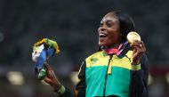 Tokyo 2020 Olympics - Athletics - Women's 200m - Medal Ceremony - Olympic Stadium, Tokyo, Japan - August 4, 2021. Gold medallist Elaine Thompson-Herah of Jamaica celebrates on the podium REUTERS/Lindsey Wasson
