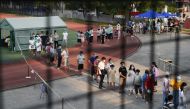 Residents line up at a nucleic acid testing site during a citywide mass testing following new cases of the coronavirus disease (COVID-19) in Wuhan, Hubei province, China, August 3, 2021. Reuters/Stringer 