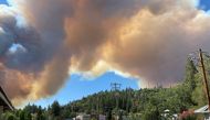 Smoke billows from the River Fire in Colfax, California, U.S., August 4, 2021, in this picture obtained from social media. TWITTER @WestCoastDrone1/via REUTERS