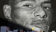 FILE PHOTO: Stand Up to Racism Demonstration at the Marcus Rashford mural after it was defaced following the Euro 2020 Final between Italy and England - Withington, Manchester, Britain - July 13, 2021. REUTERS/Peter Powell/File Photo
