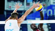 Cherif Younousse of Qatar shoots to score against the Russian Olympic Committee team as Oleg Stoyanovskiy tries to block his effort during their semi-final match played in Tokyo, yesterday.