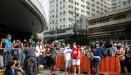 Filipinos waiting to be vaccinated against the coronavirus disease (COVID-19) gather outside a mall, a day before stricter lockdown measures are implemented, in Manila, Philippines, August 5, 2021. REUTERS/Lisa Marie David


