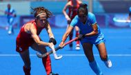 Tokyo 2020 Olympics - Hockey - Women - Bronze medal match - Britain v India - Oi Hockey Stadium, Tokyo, Japan - August 6, 2021. Anna Toman of Britain in action against Monika Malik of India. REUTERS/Bernadett Szabo
