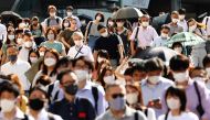 People wearing protective masks, amid the coronavirus disease (COVID-19) outbreak, make their way in Tokyo, Japan, August 6, 2021. REUTERS/Kim Kyung-Hoon

