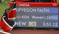  Faith Kipyegon of Kenya celebrates winning the gold medal and breaking the Olympic record REUTERS/Phil Noble