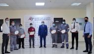 Employees of IAP Real Estate Projects with their ‘Employees of the Month’ awards.