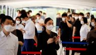 People wait in line to get coronavirus disease (COVID-19) test at a coronavirus testing site in Seoul, South Korea, July 15, 2021. REUTERS/Kim Hong-Ji/File Photo