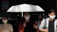 People wearing protective masks make their way, amid the coronavirus disease (COVID-19) outbreak, in Tokyo, Japan, August 10, 2021. REUTERS/Kim Kyung-Hoon