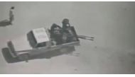 People believed to be militants are seen on a pickup truck with a gun in Afghanistan, in this still image obtained from a video posted by the Afghan Defence Ministry on its Facebook page. Reuters could not independently verify the locations nor the date o
