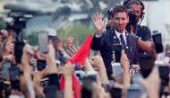 Paris St Germain's Lionel Messi gestures to fans outside the stadium after the press conference Reuters/Yves Herman