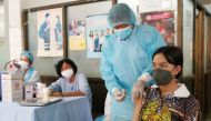 A teenager receives a vaccine dose against the coronavirus disease (COVID-19) at a health center as Cambodia begins its vaccination campaign for ages 12 to 17, in Phnom Penh, Cambodia, August, 1, 2021. REUTERS/Cindy Liu/File Photo