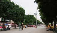 People walk along a street during a heat wave, in Tunis, Tunisia August 11, 2021. REUTERS/Jihed Abidellaoui