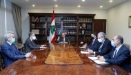 Lebanon's President Michel Aoun meets with Central Bank Governor Riad Salameh, caretaker Energy Minister Raymond Ghajar and caretaker Finance Minister Ghazi Wazni at the presidential palace in Baabda, Lebanon August 12, 2021. Dalati Nohra/Handout via Reut