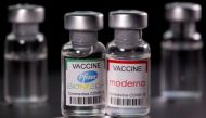 FILE PHOTO: Vials with Pfizer-BioNTech and Moderna coronavirus disease (COVID-19) vaccine labels are seen in this illustration picture taken March 19, 2021. REUTERS/Dado Ruvic/Illustration/File Photo
