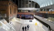 Police officers patrol through the quiet Central Station in the city centre during a lockdown to curb the spread of a coronavirus disease (COVID-19) outbreak in Sydney, Australia, August 12, 2021. REUTERS/Loren Elliott