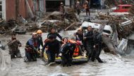 Search and Rescue team members evacuate locals during flash floods which have swept through towns in the Turkish Black Sea region, in Bozkurt, a town in Kastamonu province, Turkey, August 12, 2021. Picture taken August 12, 2021. Onder Godez/Ministry of In