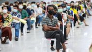 People queue at the Central Vaccination Center as Thailand opens walk-in for first dose of the AstraZeneca vaccination scheme for elders, people with a minimum weight of 100 kilograms and pregnant women amid the coronavirus (COVID-19) outbreak in Bangkok,