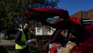 Bilal El-Hayek, a local government councillor and community leader, volunteers with Meals on Wheels to deliver food to members of vulnerable communities during a lockdown to curb the spread of a coronavirus disease (COVID-19) outbreak in the Canterbury-Ba