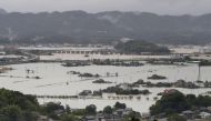 Flooded residential area caused by a torrential rain is seen in Takeo, Saga prefecture, Japan, August 14, 2021, in this photo taken by Kyodo. Mandatory credit Kyodo/via REUTERS 